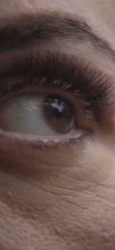A close up image of a woman's eye and eyebrow