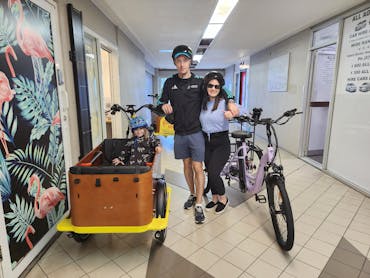Family picking up their school holiday special from our shop in Broadbeach Family picking up their school holiday special from our shop in Broadbeach