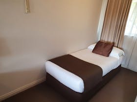 Single bed situated in alcove