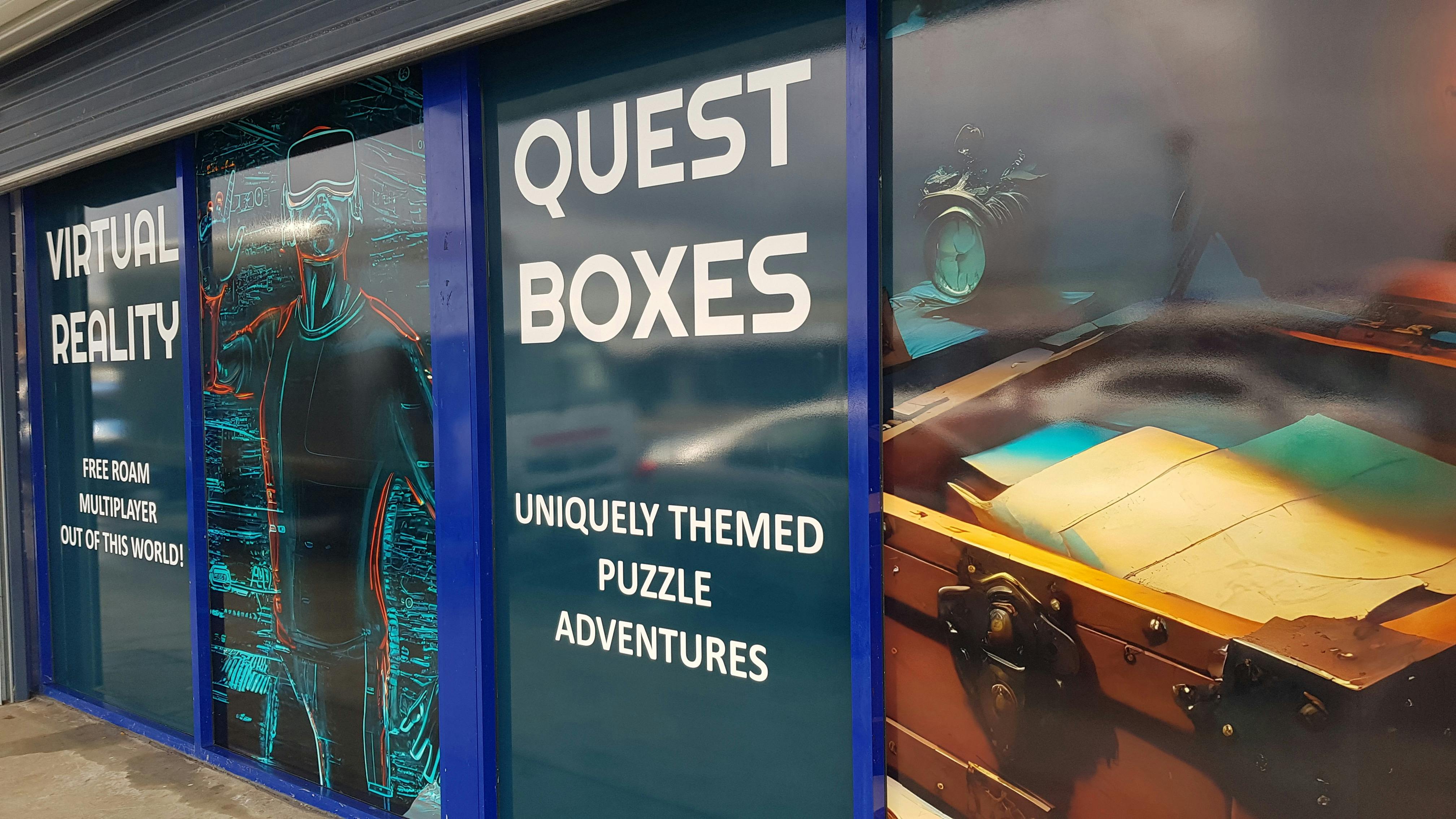 Single-level storefront with full-height signs showing virtual reality games and puzzle boxes.