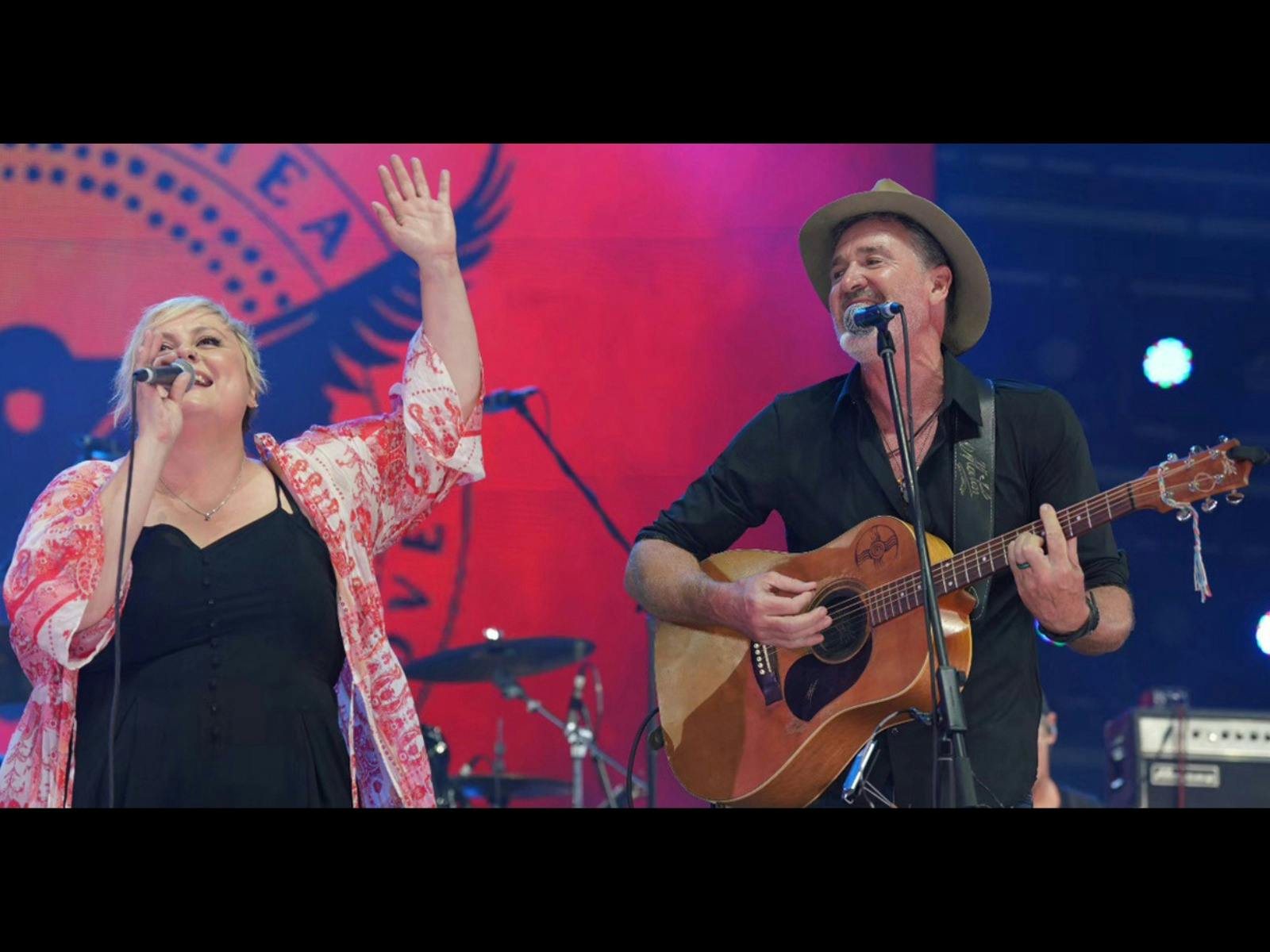 Luke & Lyn singing on the stage
