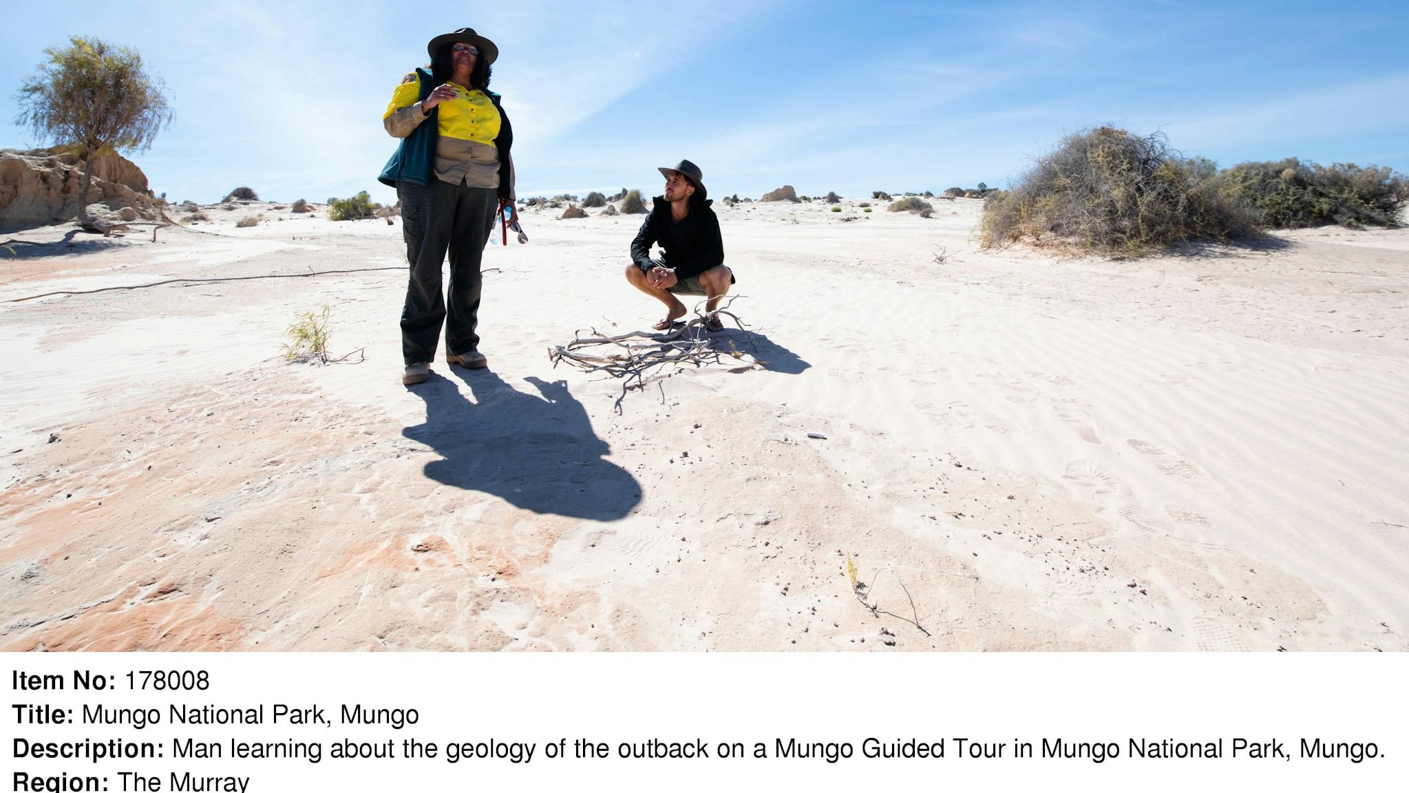 Man learning about the geology of the outback on a guided tour in Mungo National Park