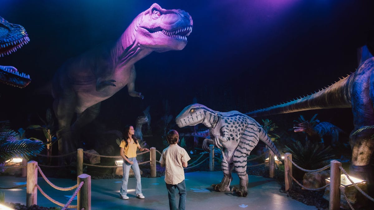 Children interacting with Dino animatronics