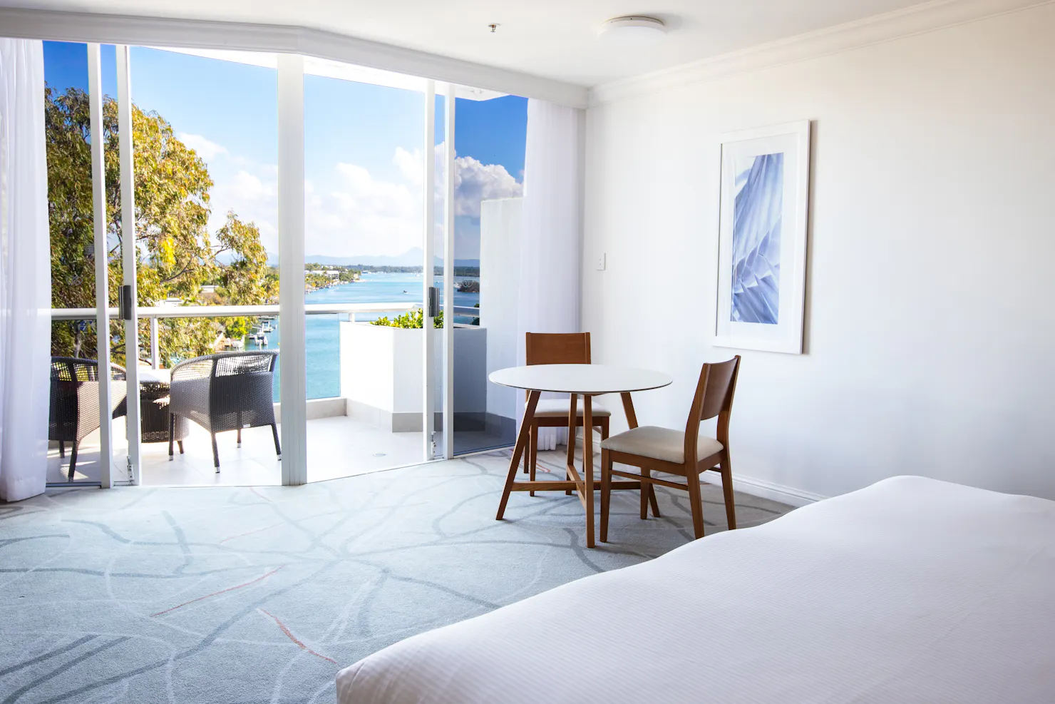 River View hotel room  with balcony and seating area,overlooks Noosa River