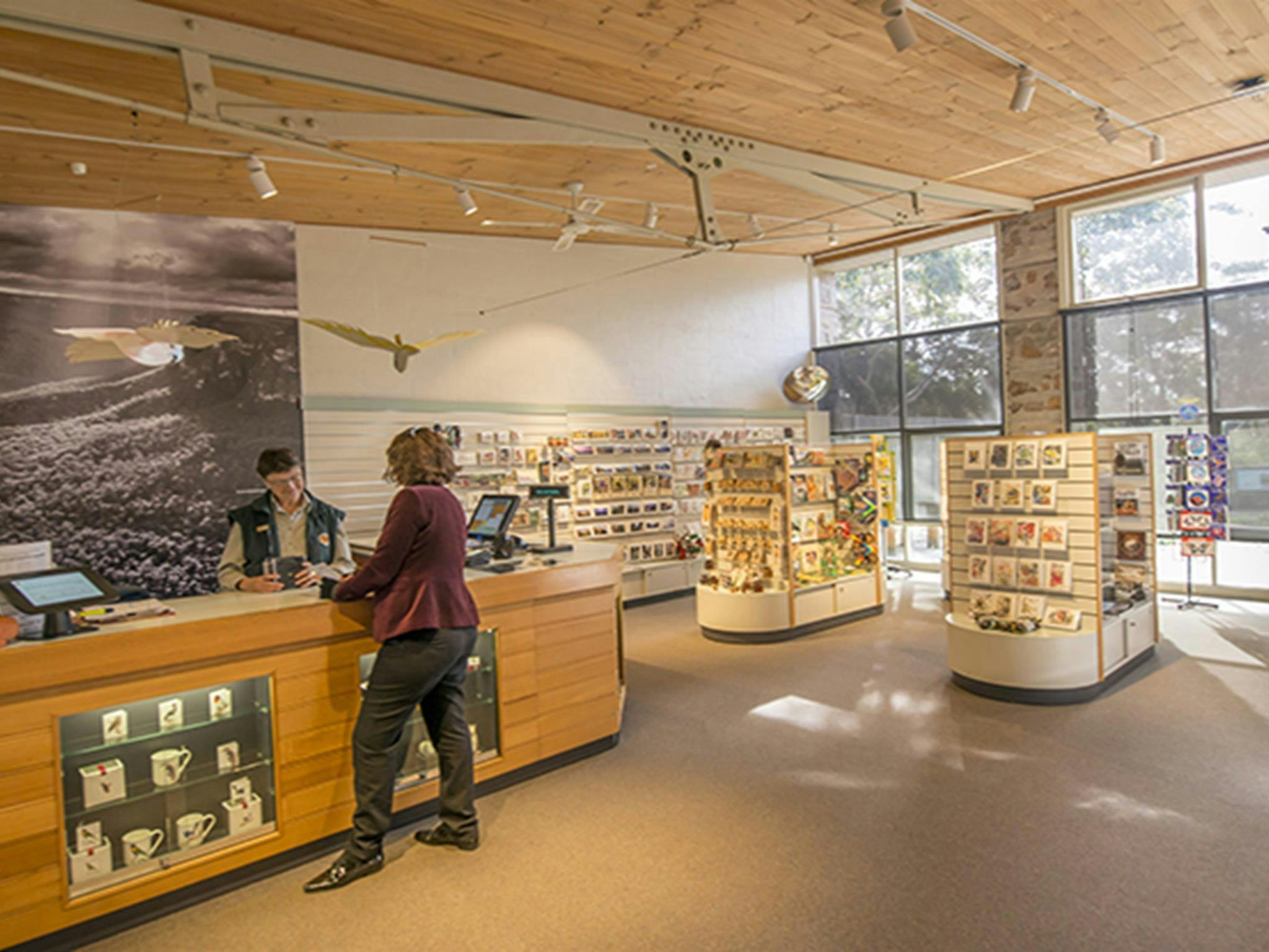 A visitor talks to staff at Blue Mountains Heritage Centre, Blue Mountains National Park. Photo: