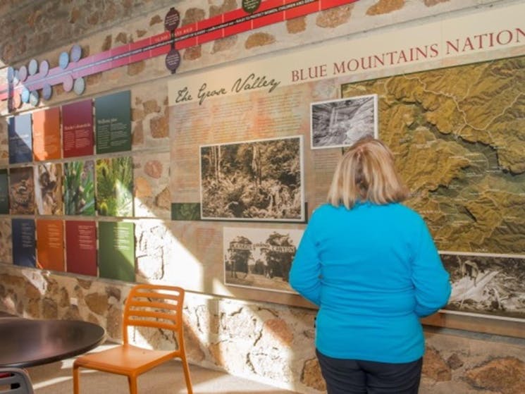 A woman looking at the displays in Blue Mountains Heritage Centre. Photo: John Spencer &copy; DPIE