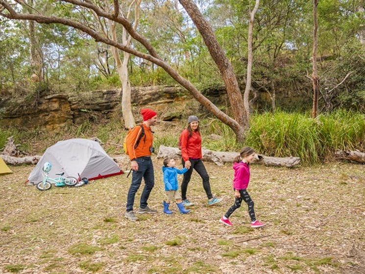 Family going for a stroll at Bonnie Vale campground, Royal National Park. Photo: John Spencer/OEH