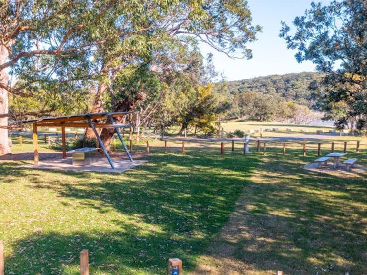 Picnic shelter and picnic tables in Bonnie Vale campground in Royal National Park. Photo: Andrew