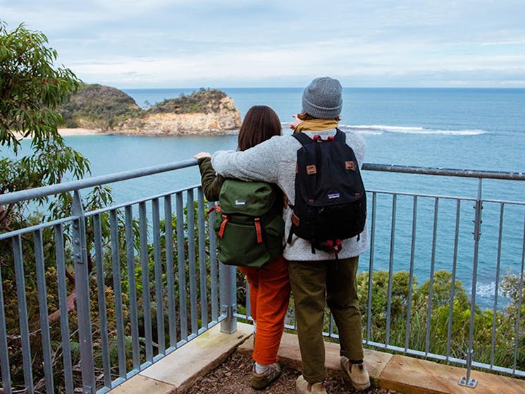 A couple at a lookout on Bouddi costal walk admiring ocean views. Photo:  Jared Lyons &copy; DPE