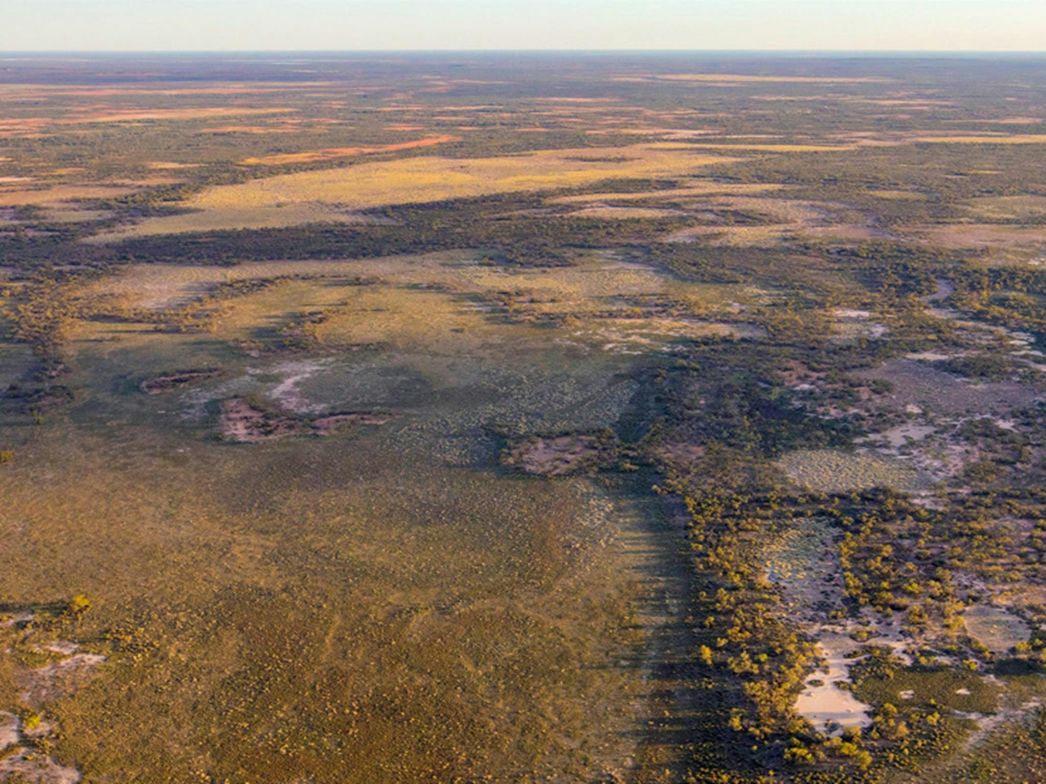 Aerial view of Brindingabba National Park, 175km from Bourke, showing its shades of red and green.