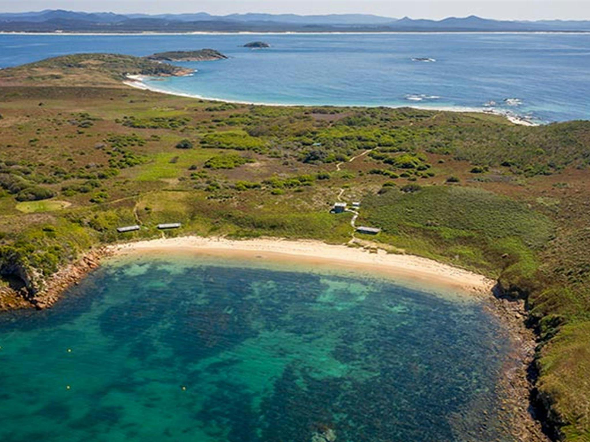 An aerial view of Broughton Island campground and nearby beach in Myall Lakes National Park. Photo: