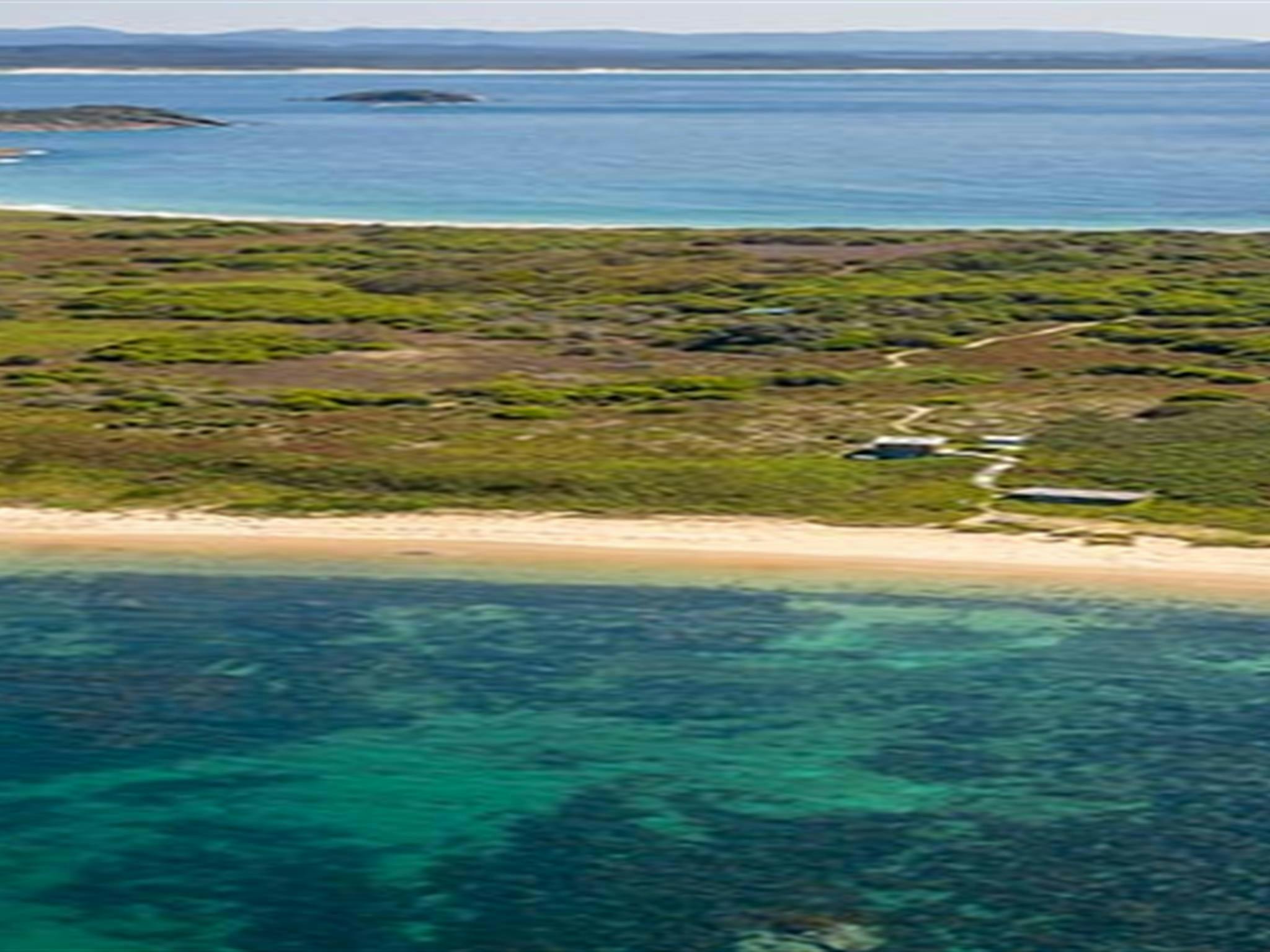 An aerial view of Broughton Island campground and nearby beach in Myall Lakes National Park. Photo: