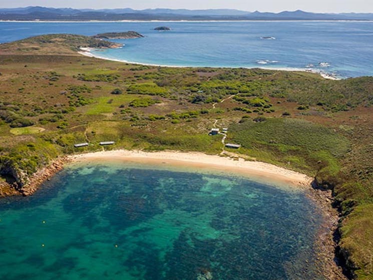 An aerial view of Broughton Island campground and nearby beach in Myall Lakes National Park. Photo:
