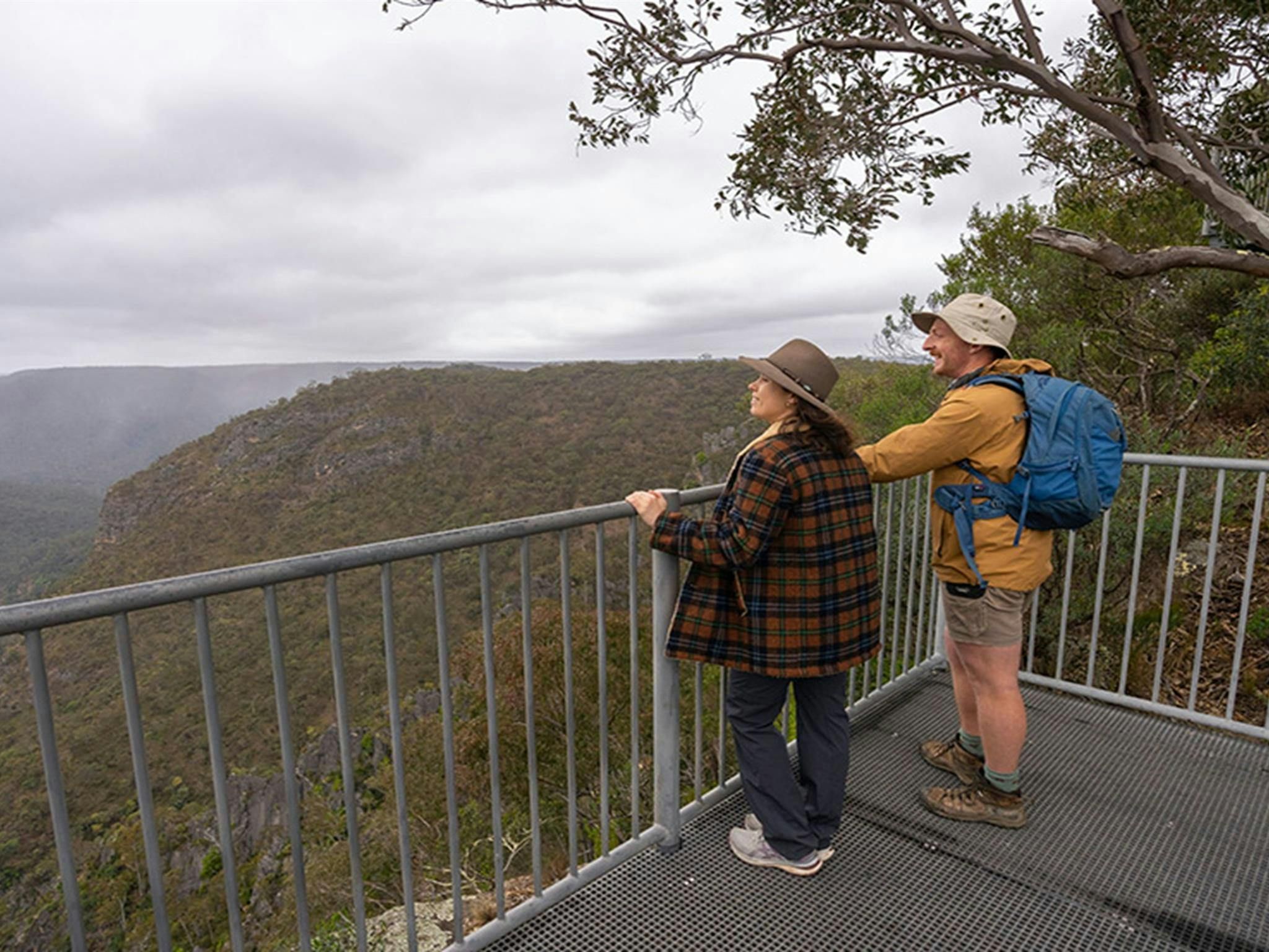 Visitors admiring the view from Adams lookout in Bungonia National Park. Photo: John Spencer/DCCEEW