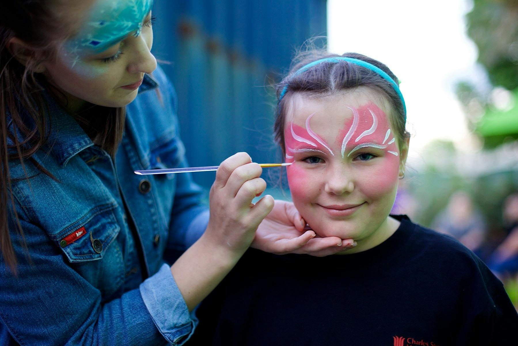 Kids having their face painted