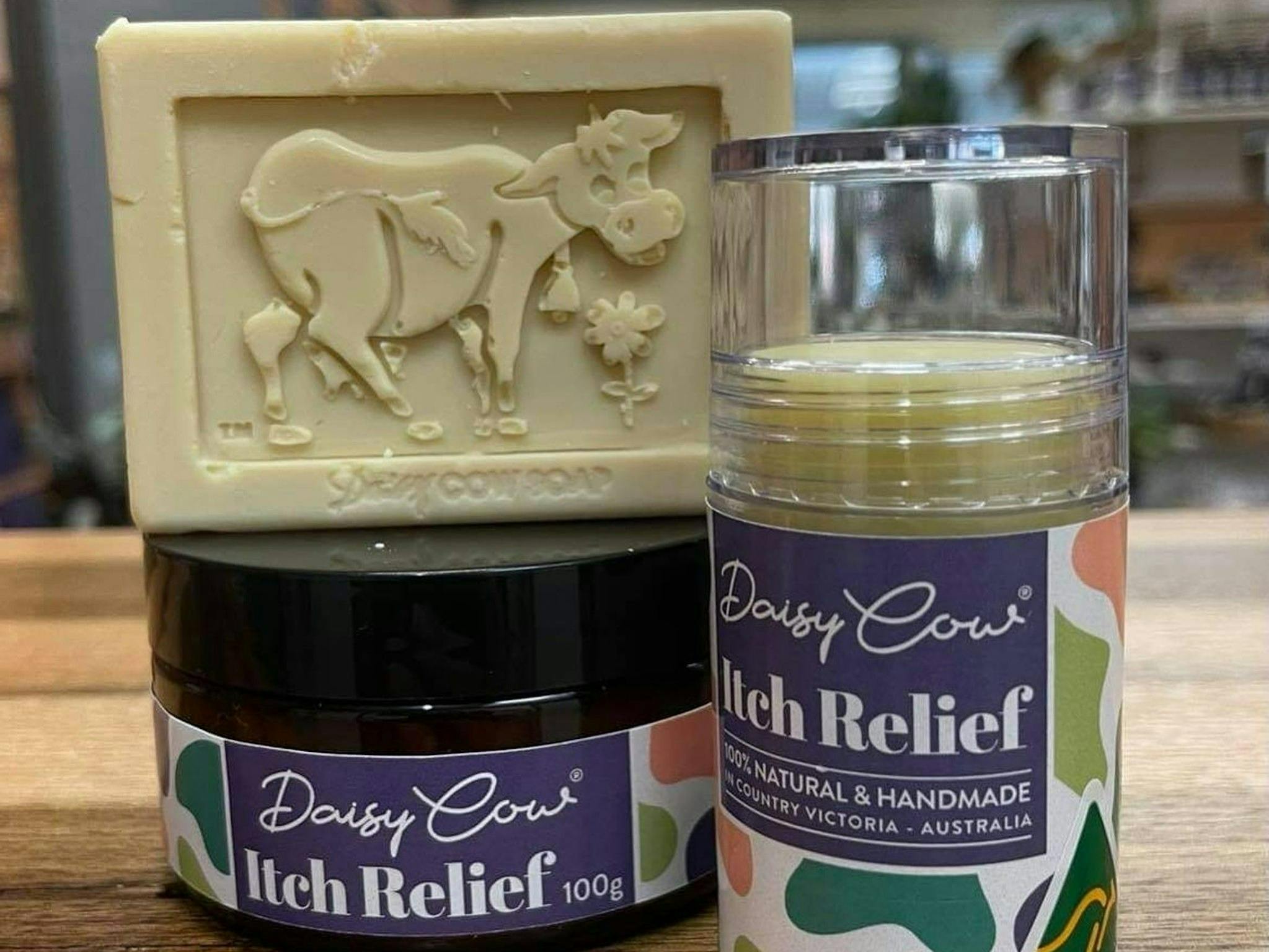 Itch Relief in a tub and applicator together with natural Daisy Cow soap