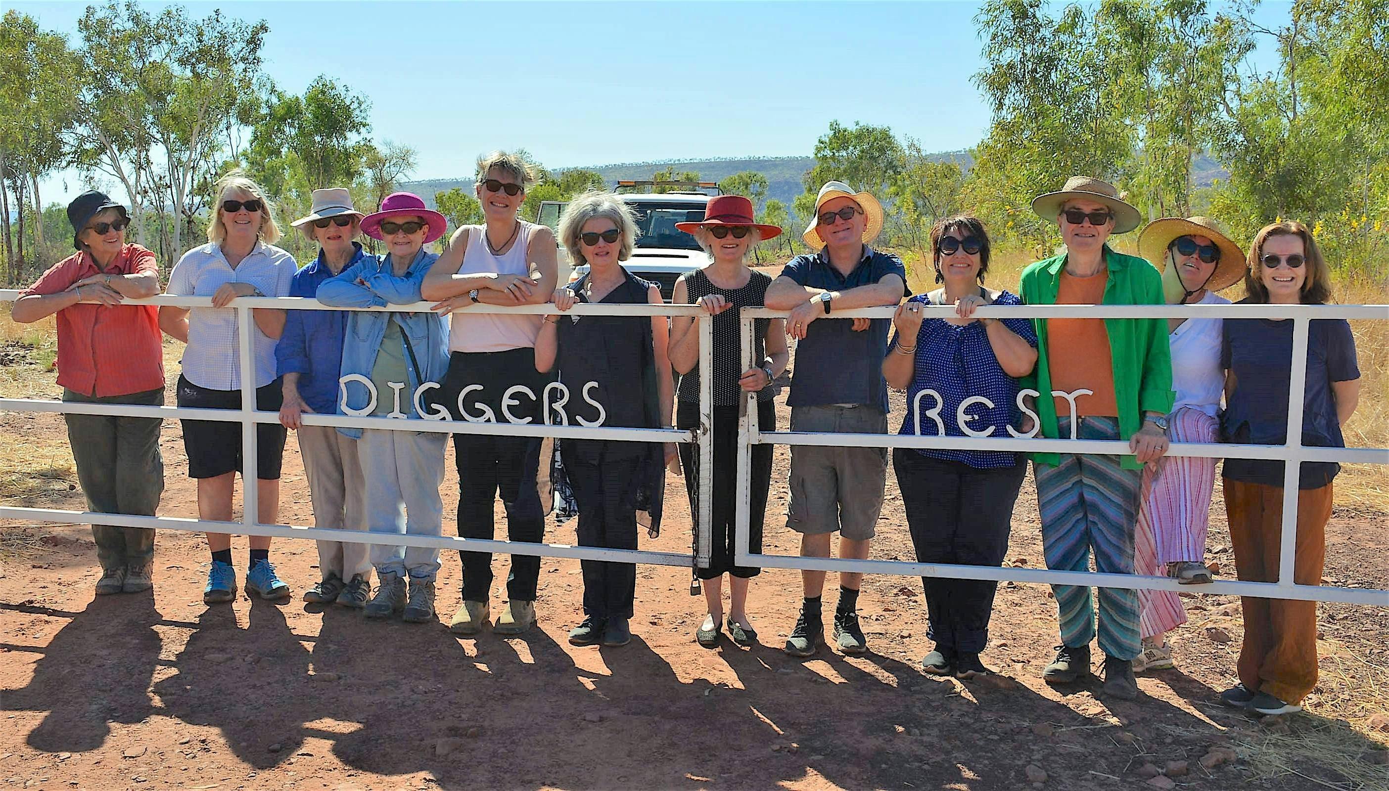 Group of artists standing at gate
