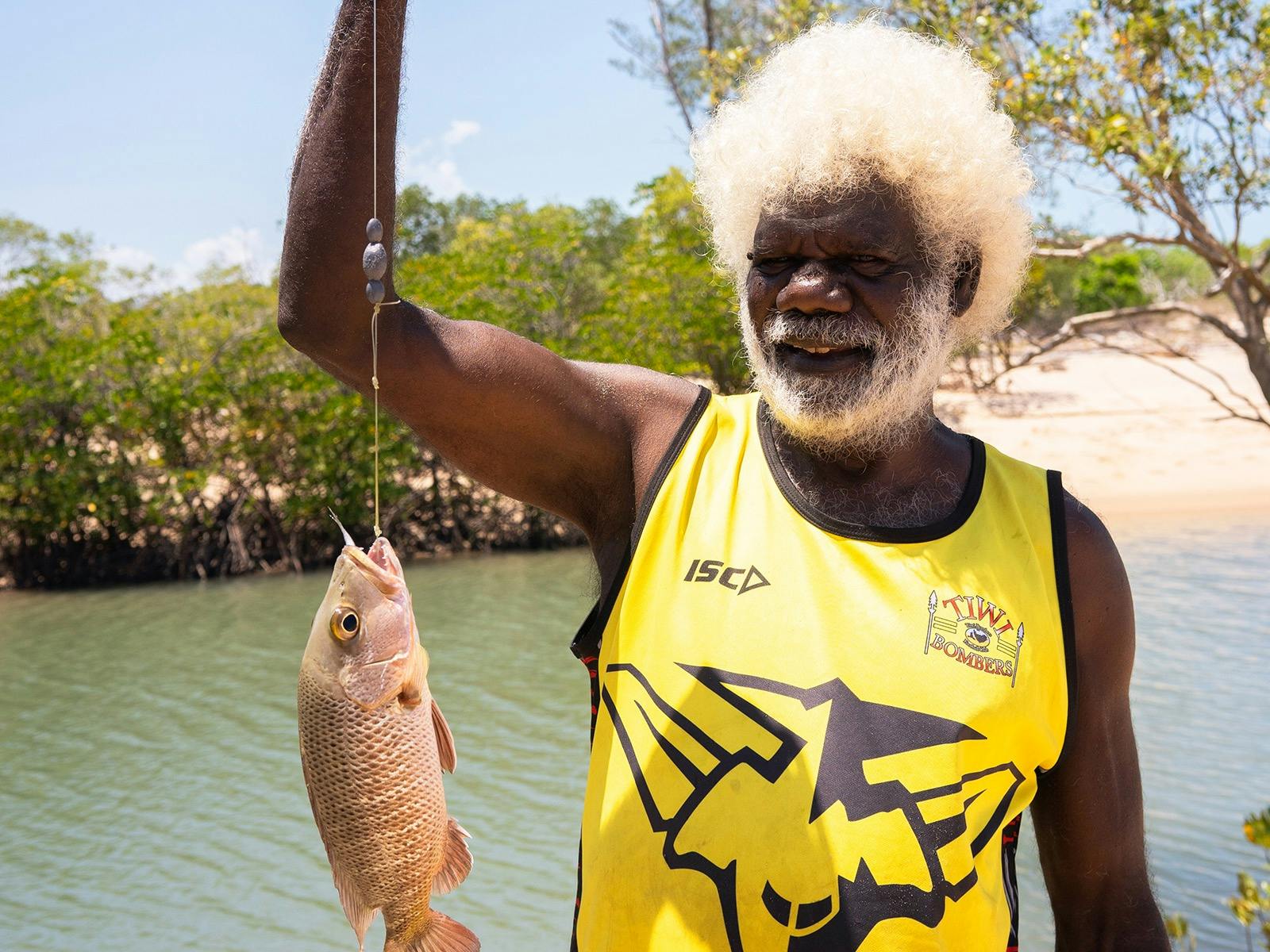 Teddy catching fish (muputi) at Tarntipi tingata (beach)