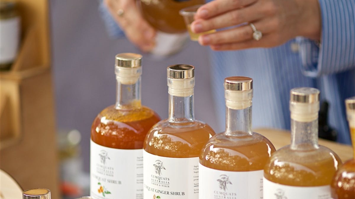 Cumquat syrup poured by the stall holder