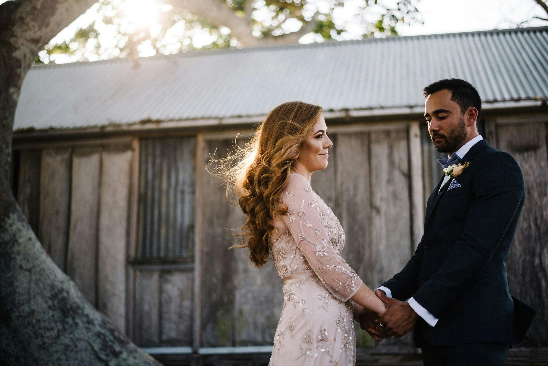 couple in front of barn