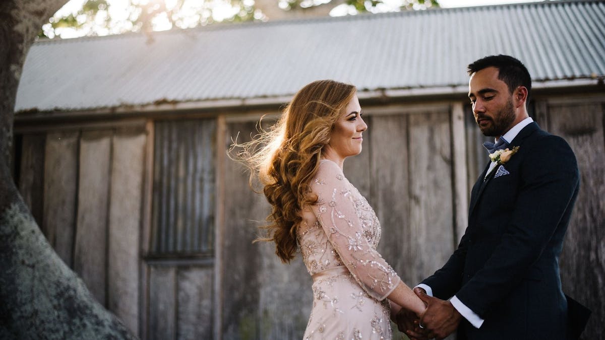 couple in front of barn
