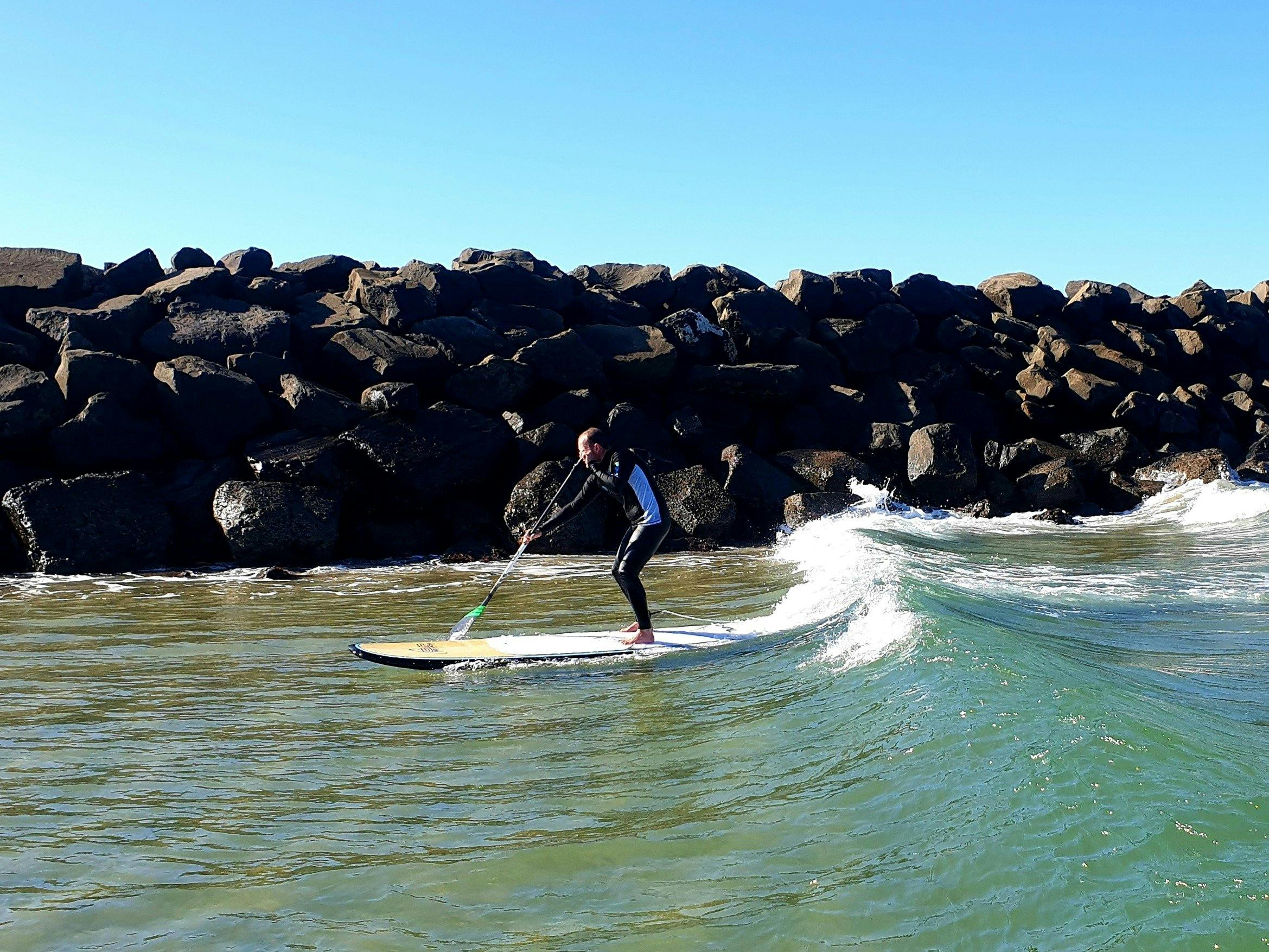 Little Lake Barrack Point provides SUP surfers with a gentle wave perfect for learning