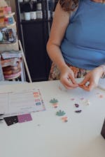 a lady making earrings