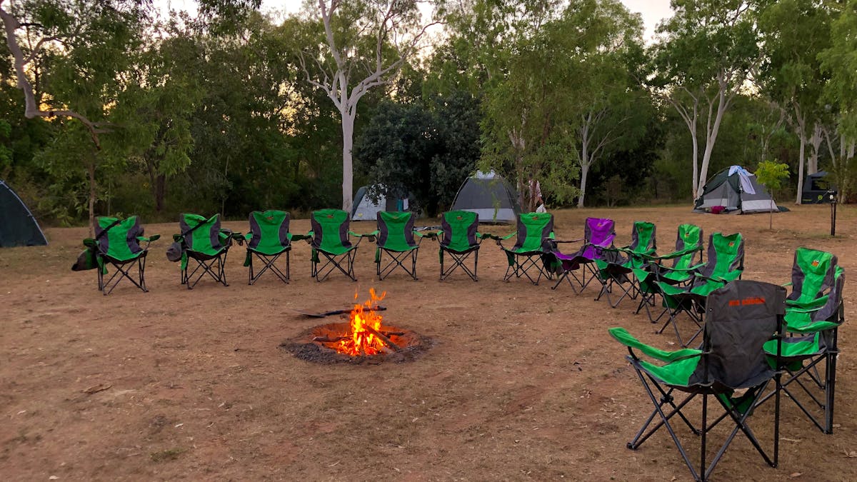campfire with chairs around it