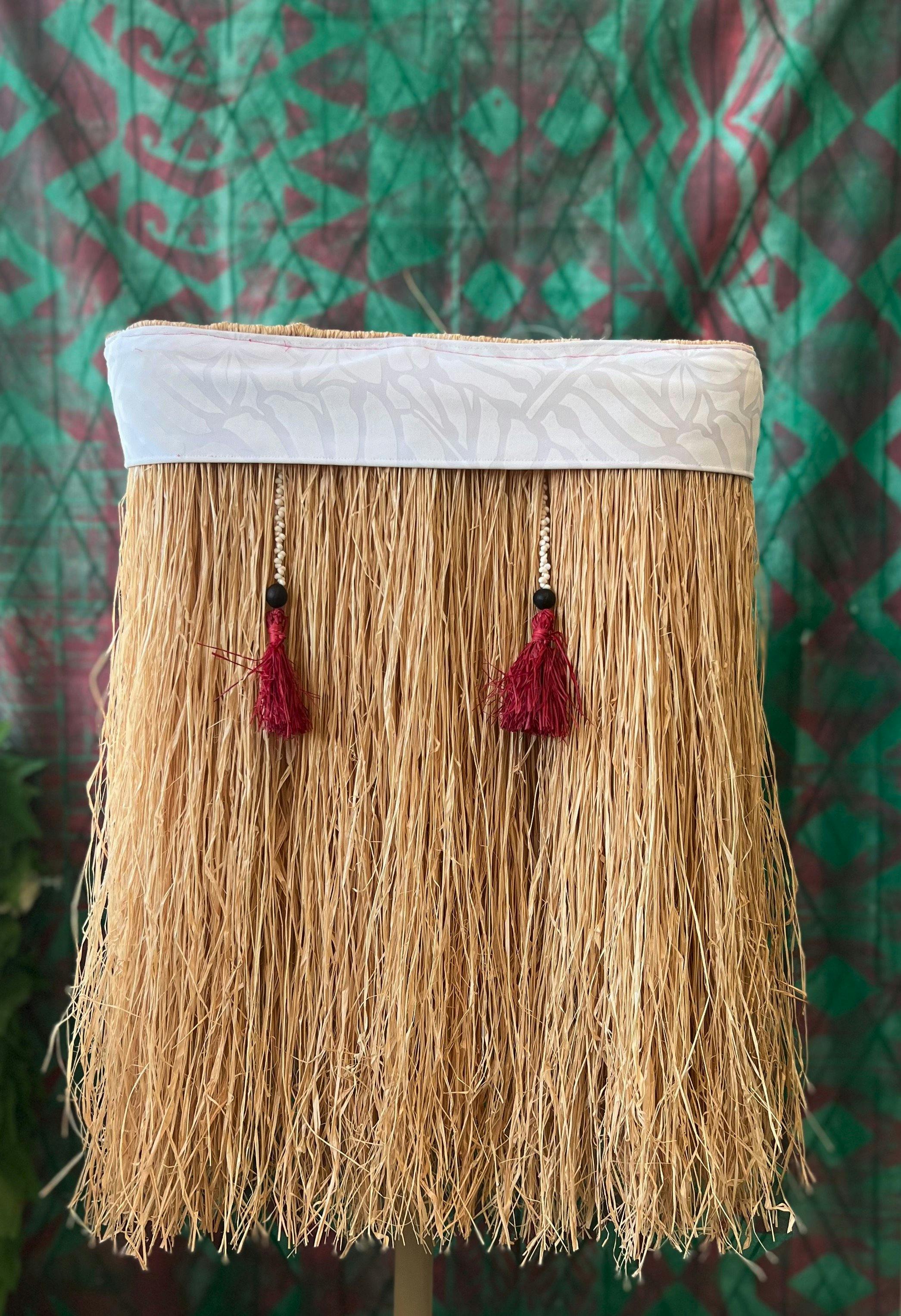 A skirt made from Raffia, beads, pupu shells and cotton by Morgan Hogg.