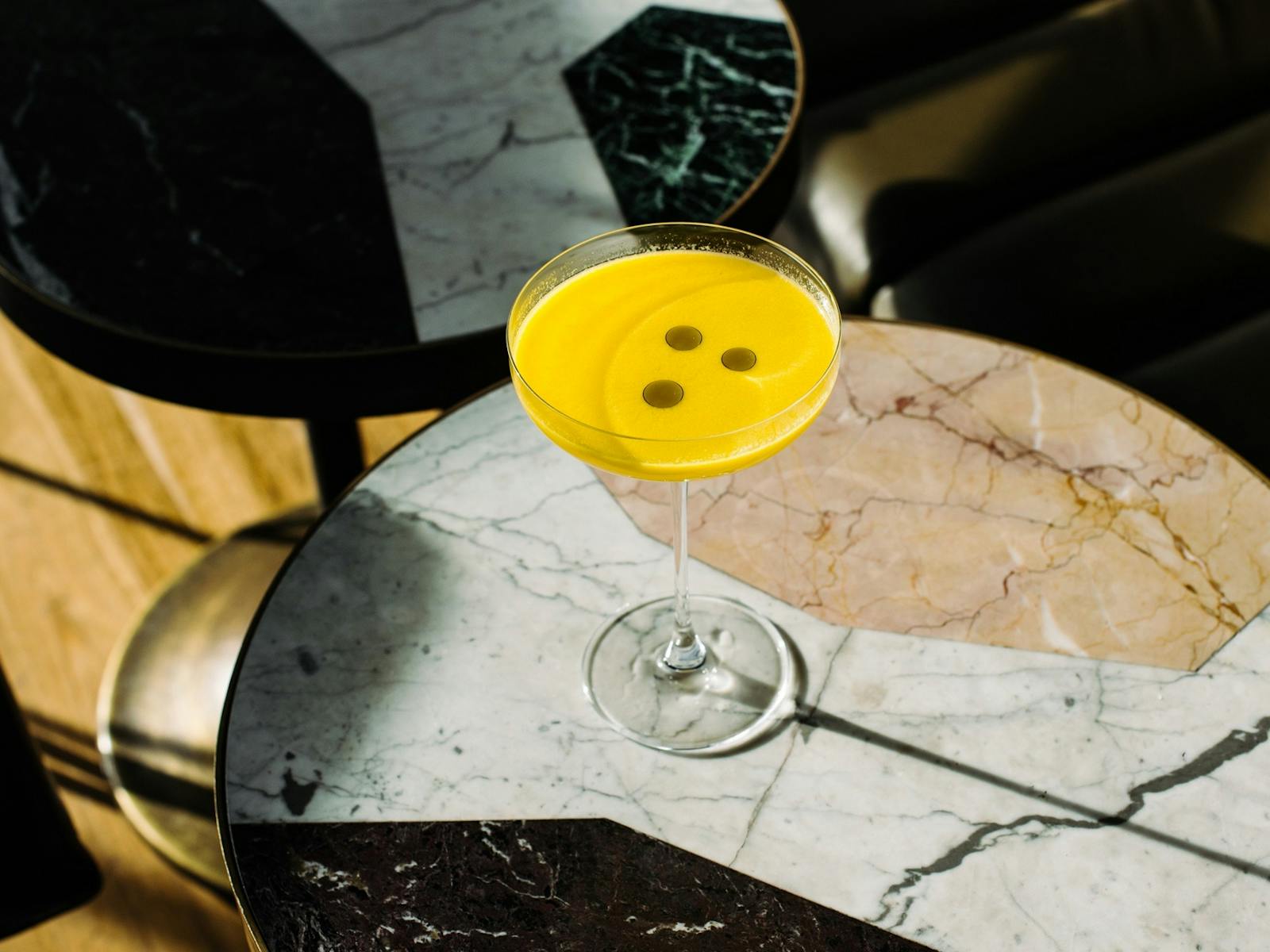 Yellow cocktail on table