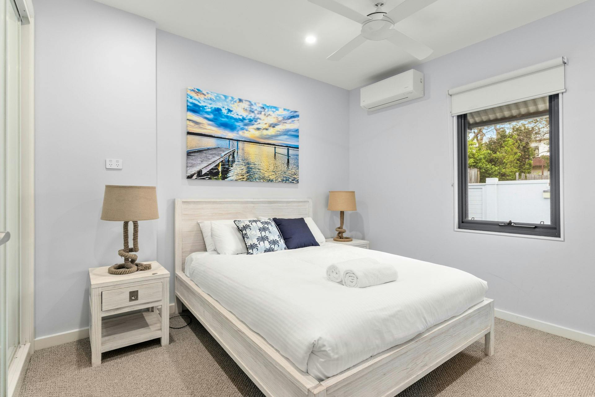 Queen bedroom with pool view and mirrored closet