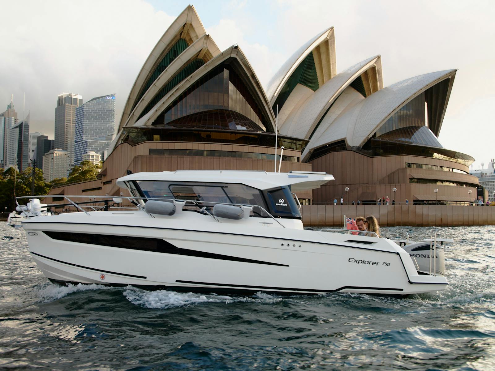 MV Explorer luxury cruise boat on Sydney Harbour with Harbour Bridge in the background.