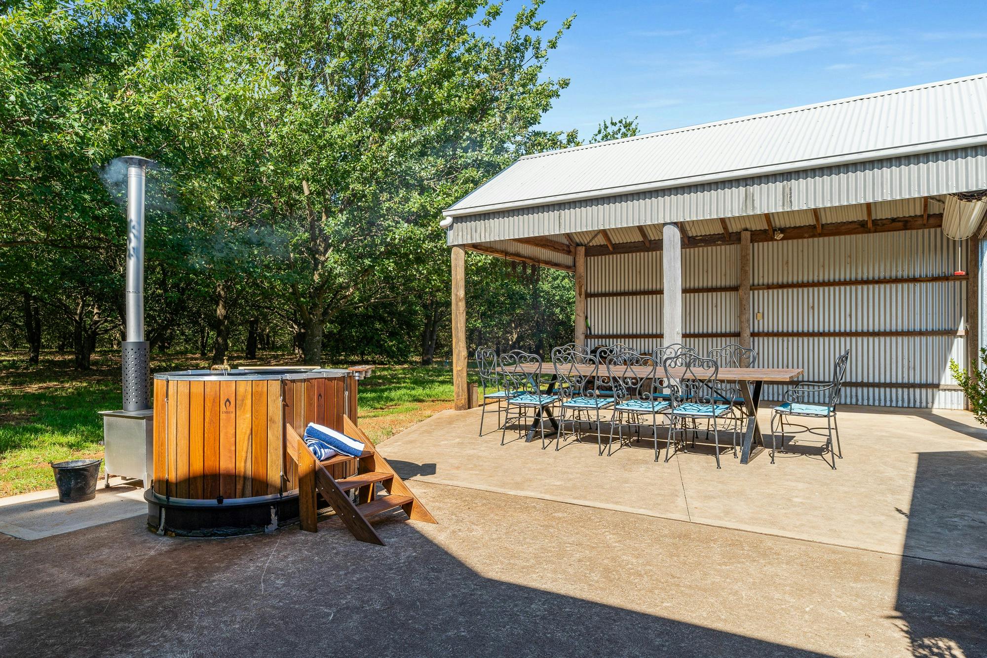 Enjoy the outside courtyard of the shack with a woodfired hot tub, and large dining table