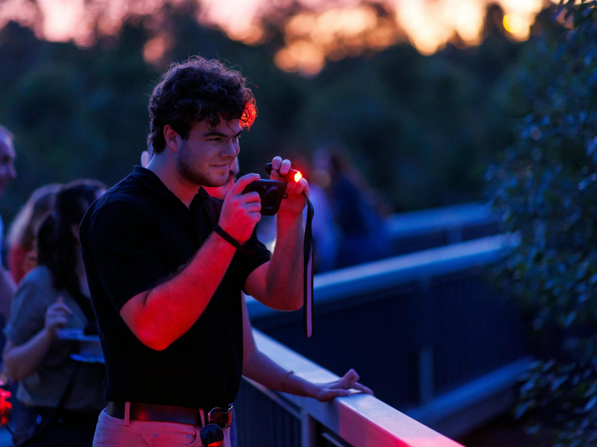 Young male searching for wildlife with thermal-imaging night vision equipment Young male searching for wildlife with thermal-imaging night vision equipment