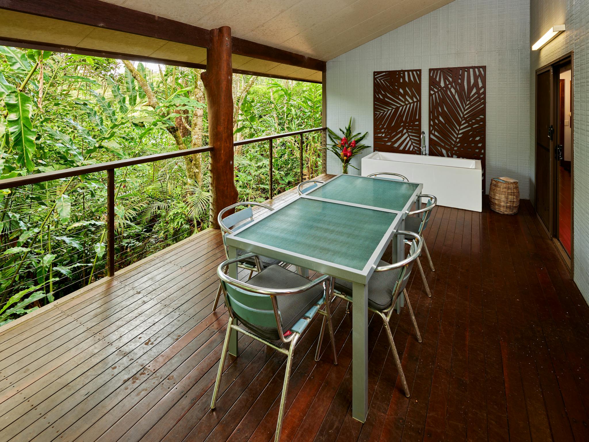 Balcony with table overlooking the rainforest. Balcony with table overlooking the rainforest.
