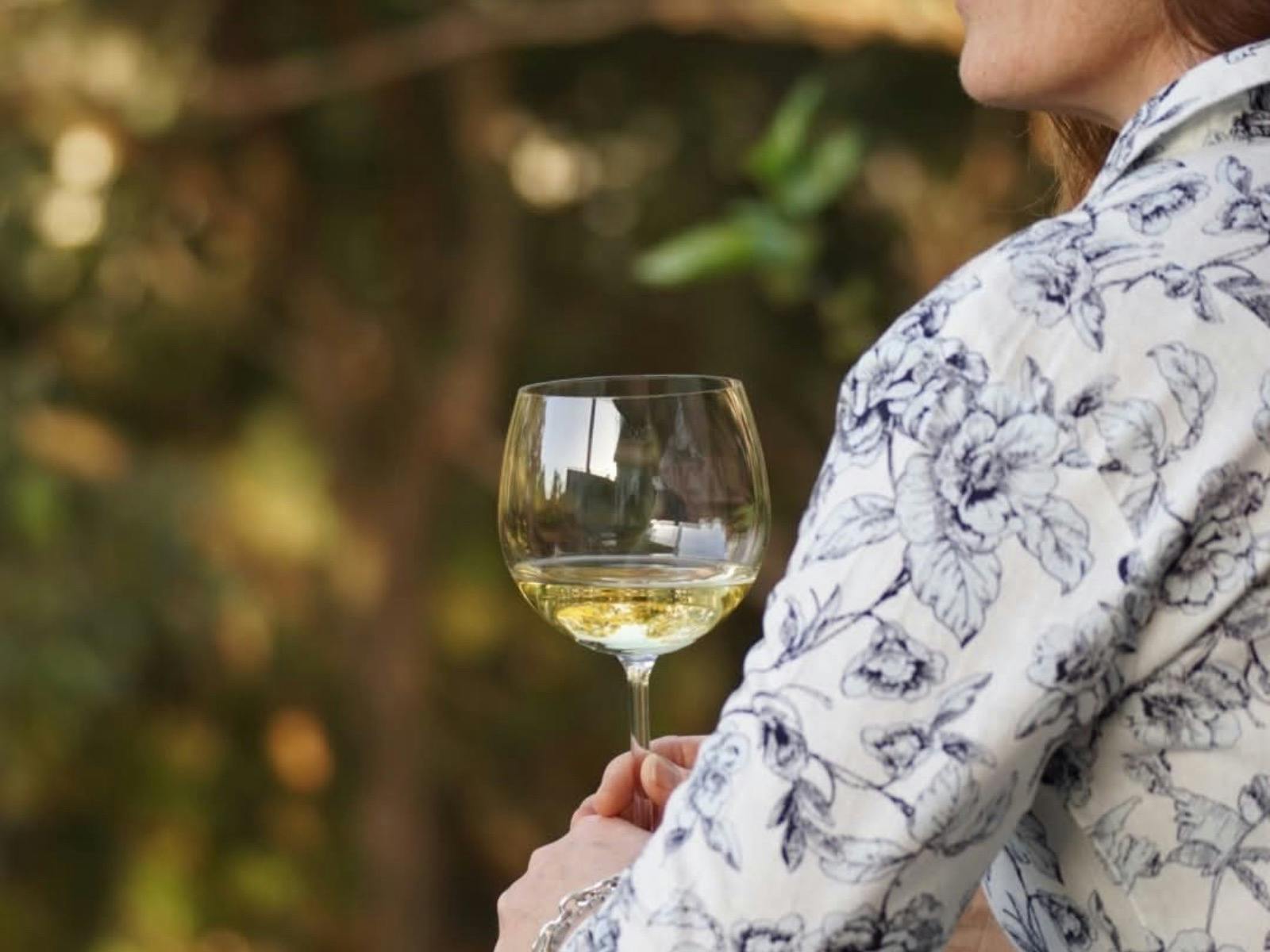 Wine glass with bushland background