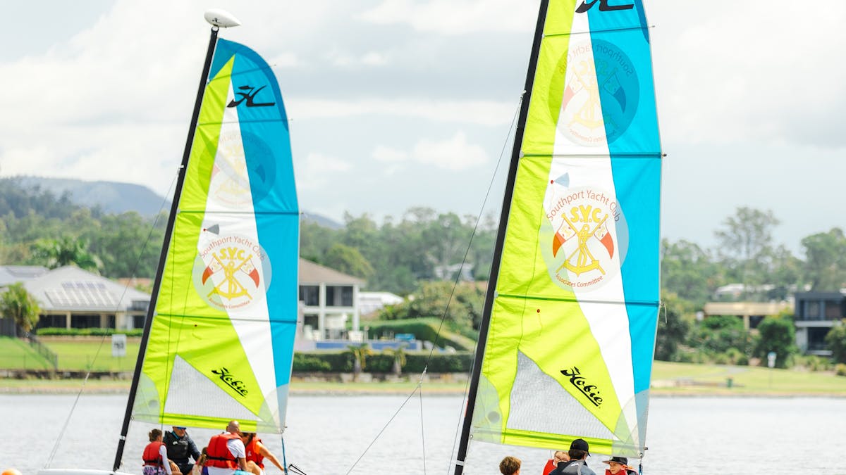 2 Sail Boats on the lake with families