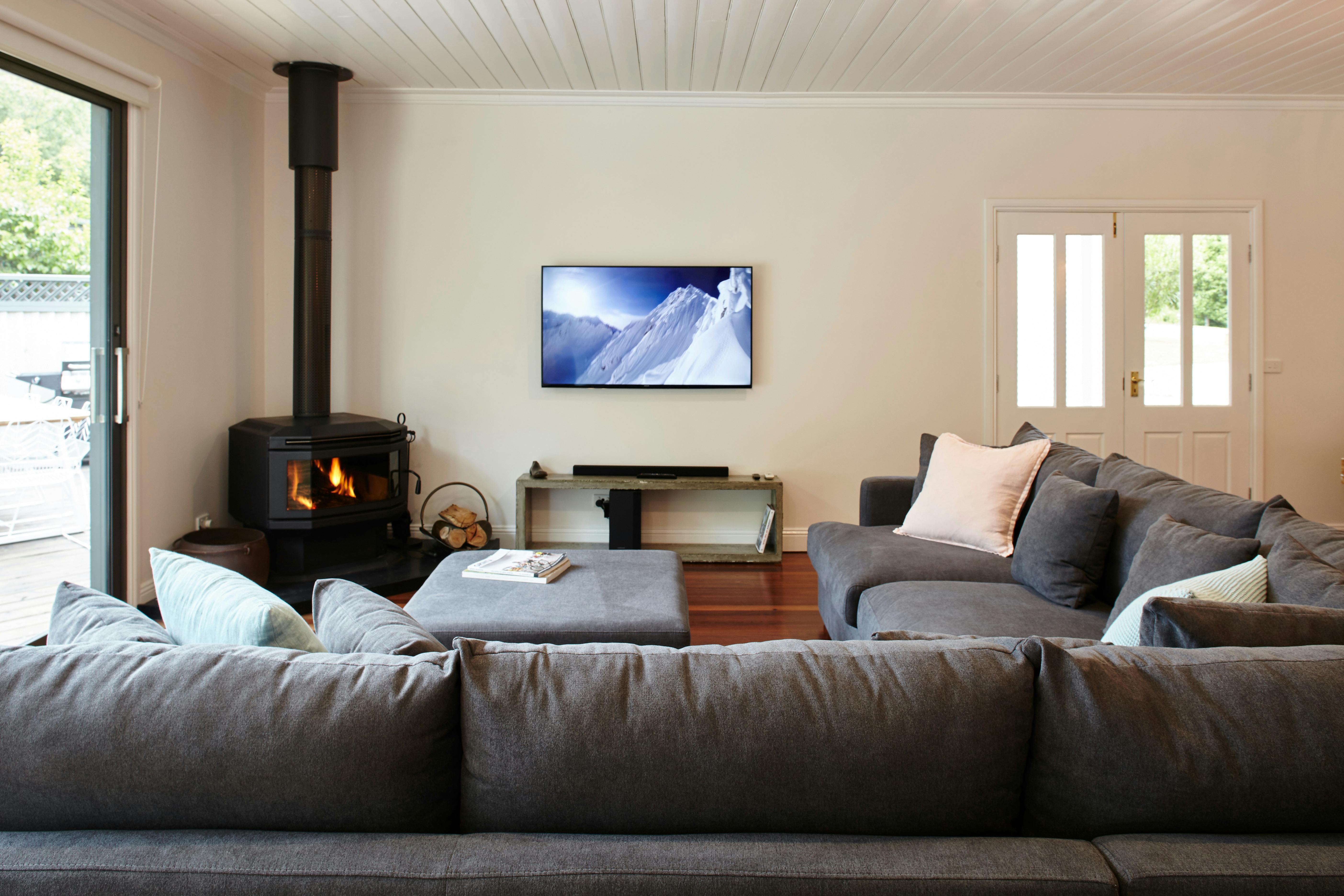 Huge comfy couches to snuggle into with family and friends by the fire, or watching kids in the pool