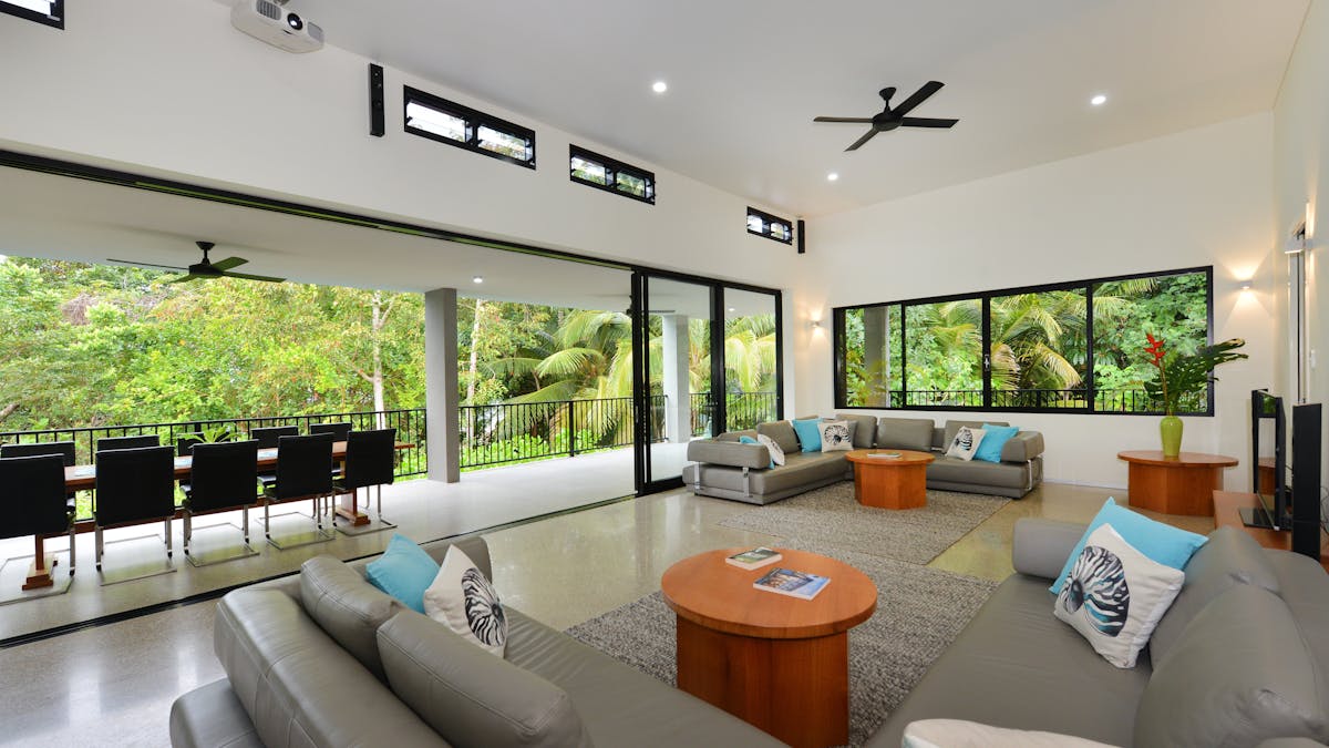 Enjoy the tropical gardens from the custom crafted European leather sofas.