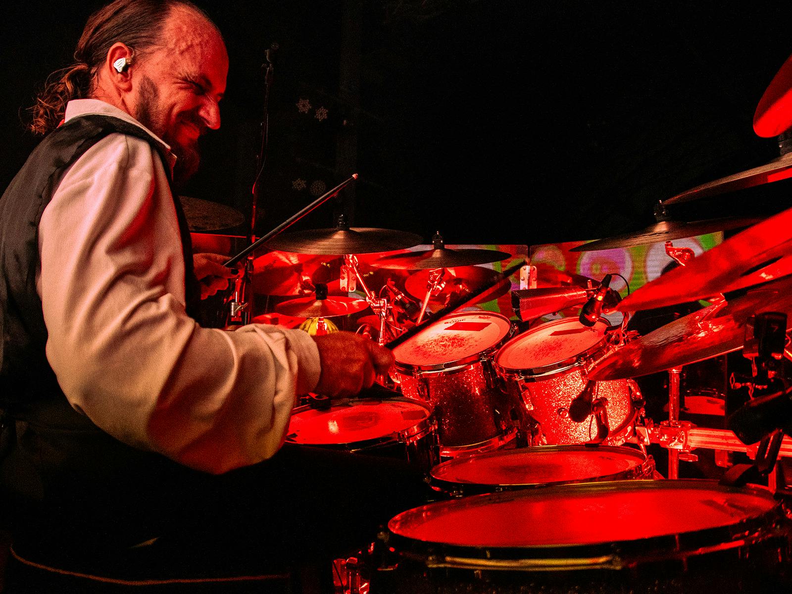 Former Dreams Show members performing Fleetwood Mac hits onstage with full crowd energy.