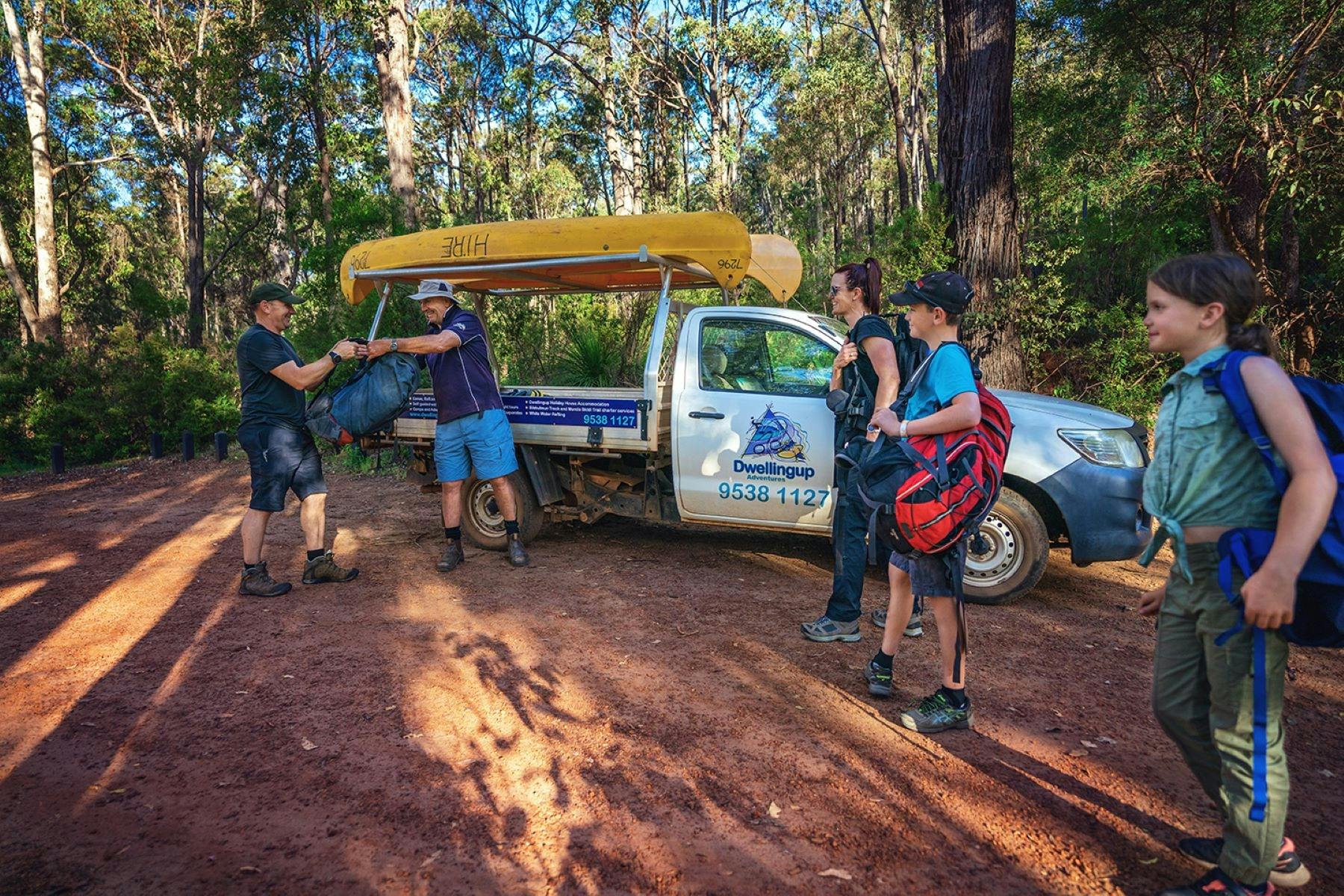 Hikers transferring packs into Dwellingup Adventures vehicle