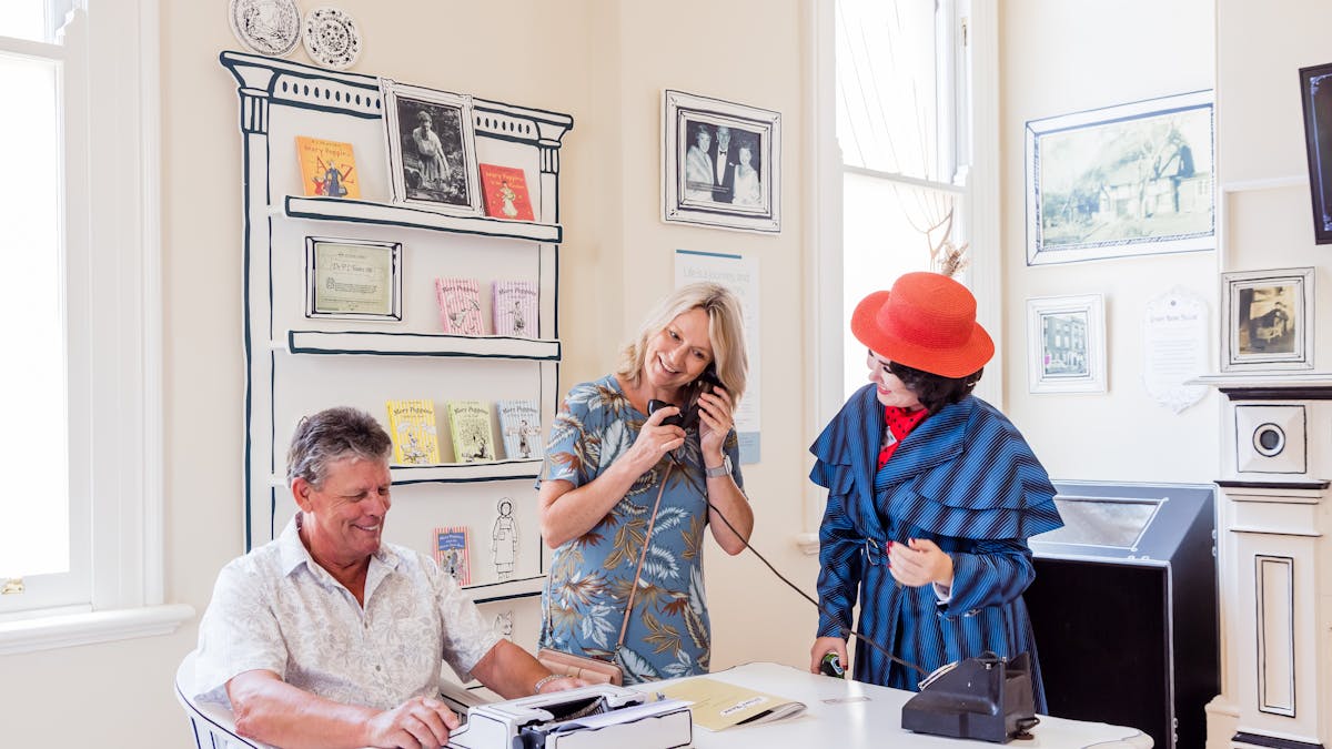 Interpreter and visitors inside The Story Bank