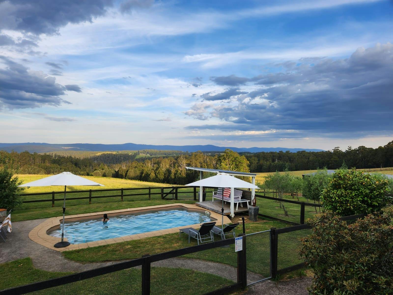 A swimming pool with a mountain view