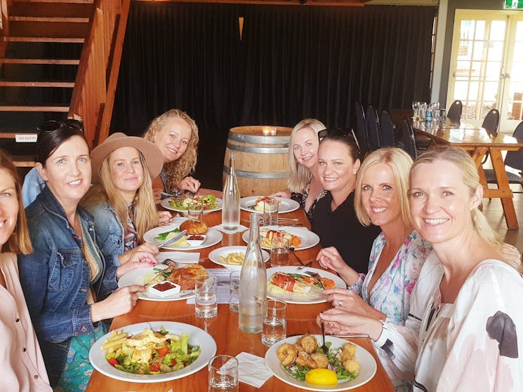 group having lunch at a winery south coast