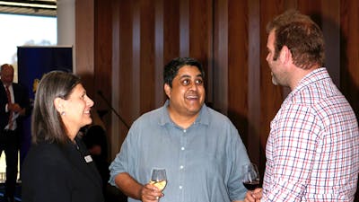 people talking and tasting wine