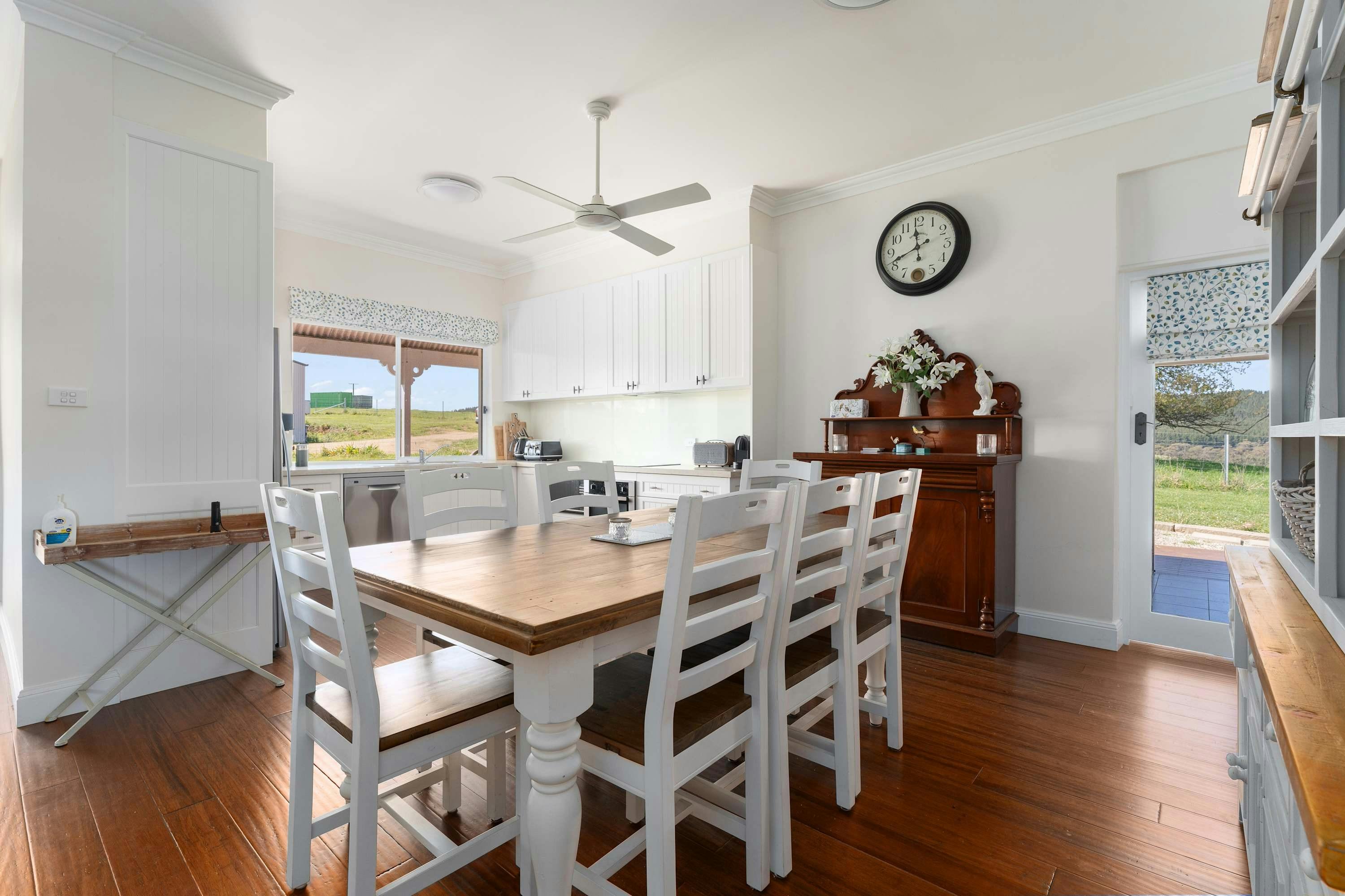 Large dining table with large open kitchen