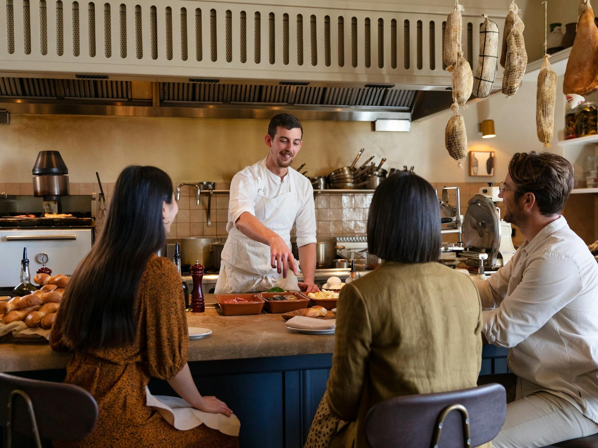 Chef preparing tapas at Una Mas restaurant at the Coogee Pavilion.