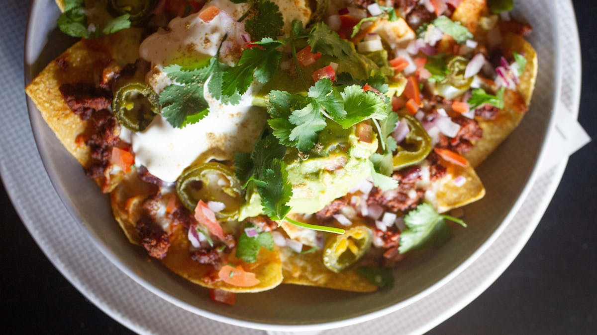 An overhead view of a plate of nachos