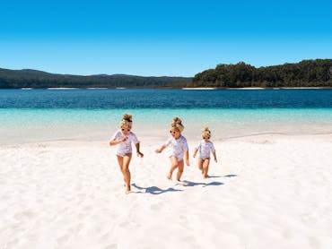 Kids on beach at Lake McKenzie, K'gari (Fraser Island) Kids on beach at Lake McKenzie, K'gari (Fraser Island)