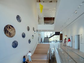 Shepparton Art Museum interior shot of stairwell and people in the space